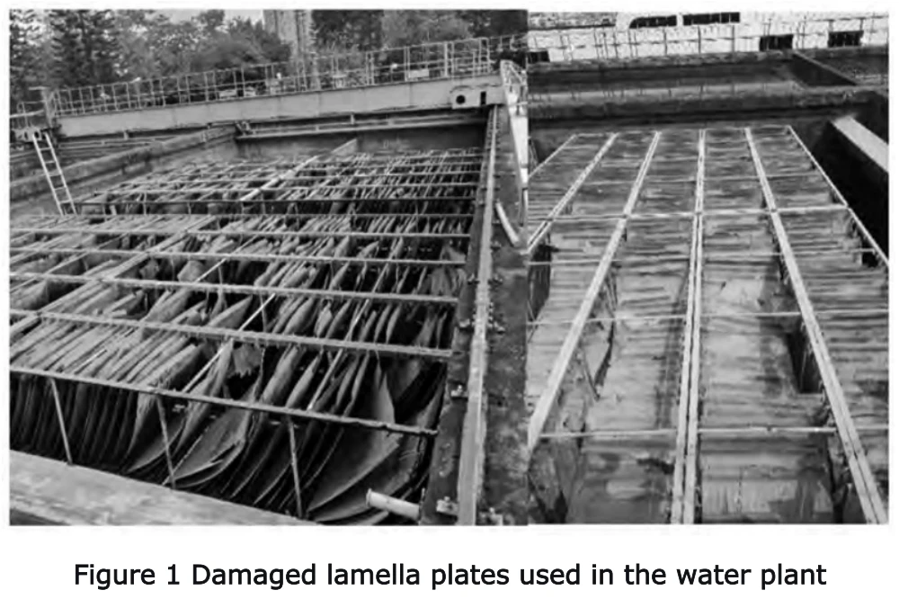 Damaged and aged PVC inclined plates in the flotation-sedimentation tank before retrofit, showing cracking and structural failure after the 2020 flood