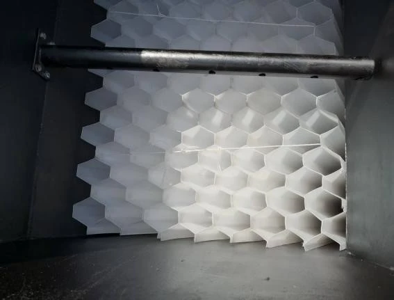 Hexagonal PP tube settler modules installed in a sedimentation tank with a perforated sludge draw-off pipe above Hexagonal PP tube settler modules installed in a sedimentation tank with a perforated sludge draw-off pipe above